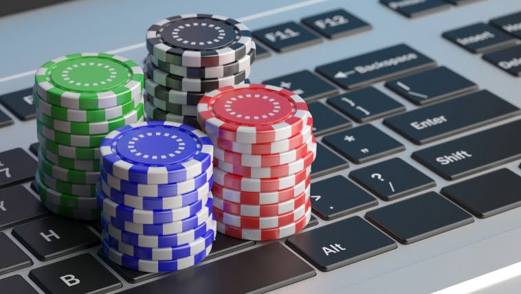 keyboard with poker chips next to it
